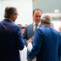 Three men talking