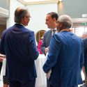 Three men talking